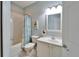 Bathroom with a tub and shower combination and a single sink vanity with light blue walls at 302 Latitude Pl, Apollo Beach, FL 33572