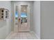 Entrance featuring a glass front door offering view to the backyard at 302 Latitude Pl, Apollo Beach, FL 33572