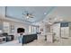Living room with a modern couch, large windows, and plank flooring at 302 Latitude Pl, Apollo Beach, FL 33572