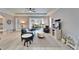 Bright living room with modern decor, comfortable seating, and sliding glass doors to the patio at 302 Latitude Pl, Apollo Beach, FL 33572