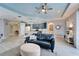 Open concept living space with blue accents, a ceiling fan, and plank flooring at 302 Latitude Pl, Apollo Beach, FL 33572