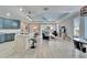 Open-concept living space showcases a modern kitchen, dining area, and comfortable living room at 302 Latitude Pl, Apollo Beach, FL 33572