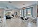Bright and airy living space with modern furnishings, stylish decor, and access to outdoor space at 302 Latitude Pl, Apollo Beach, FL 33572