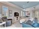 Cozy living space with a stylish recliner, comfortable sofa, and dining area with modern lighting at 302 Latitude Pl, Apollo Beach, FL 33572