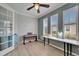 Bright office features a ceiling fan, lots of natural light and a desk area with space for a keyboard and office furniture at 302 Latitude Pl, Apollo Beach, FL 33572