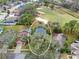 Aerial view of the property, featuring a pool and a manicured golf course nearby at 5608 Rockfield Loop, Valrico, FL 33596