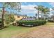 The backyard boasts lush landscaping, a screened-in pool, and a well-maintained lawn at 5608 Rockfield Loop, Valrico, FL 33596