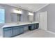Bathroom with double vanity, sleek countertops, modern fixtures, and soft gray walls, offering a spa-like feel at 5608 Rockfield Loop, Valrico, FL 33596