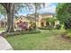 Charming two-story home with a well-manicured lawn and mature landscaping at 5608 Rockfield Loop, Valrico, FL 33596
