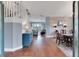 Open-concept floor plan with hardwood floors, decorative walls, and natural light at 5608 Rockfield Loop, Valrico, FL 33596