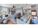 Inviting living room with fireplace, built-ins, plush seating, and open access to the dining area at 5608 Rockfield Loop, Valrico, FL 33596