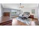 Serene main bedroom with hardwood floors, a comfortable bed, and ample natural light at 5608 Rockfield Loop, Valrico, FL 33596