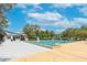 Community swimming pool with multiple lanes, shade structures, and well-maintained surroundings at 5608 Rockfield Loop, Valrico, FL 33596