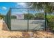 Fenced community tennis court for recreation and competitive play at 5608 Rockfield Loop, Valrico, FL 33596