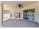 Large, covered patio, with recessed lighting and fan, is ideal for outdoor living and entertainment at 924 Landmark S Cir, Tierra Verde, FL 33715