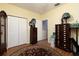 Bright bedroom with ample closet space, hardwood floors, and room for furniture at 9341 Blind Pass Rd, St Pete Beach, FL 33706