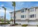 Inviting condo complex with garages and well-maintained landscaping at 9341 Blind Pass Rd, St Pete Beach, FL 33706
