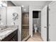Well-lit bathroom featuring a walk-in shower with a built-in bench, decorative tile, and a granite countertop vanity at 11001 Hobson St, Spring Hill, FL 34608