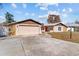 Charming home features an attached garage, long driveway and manicured front yard at 11001 Hobson St, Spring Hill, FL 34608
