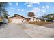 Charming home features an attached garage, long driveway and manicured front yard at 11001 Hobson St, Spring Hill, FL 34608