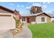 Charming single-Gathering home with stone accents, a well-manicured lawn, and an American flag proudly displayed at 11001 Hobson St, Spring Hill, FL 34608