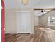 Inviting foyer features wood-look tile flooring, a ceiling fan, and a bright, neutral color palette at 11001 Hobson St, Spring Hill, FL 34608