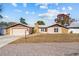 Charming home featuring an attached garage, tidy landscaping, and a welcoming entrance at 11001 Hobson St, Spring Hill, FL 34608