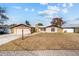 Charming home with stone accents, a well-manicured lawn, and mature landscaping at 11001 Hobson St, Spring Hill, FL 34608