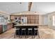 Updated kitchen features stainless steel appliances, a center island with bar seating, and ample cabinet space at 11001 Hobson St, Spring Hill, FL 34608