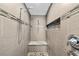Modern tiled shower with built-in niche, bench seating, and sleek fixtures at 11001 Hobson St, Spring Hill, FL 34608