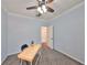Bedroom featuring blue walls, ceiling fan, and gray carpet at 2160 Chianti Pl # 11-0117, Palm Harbor, FL 34683