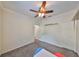 Neutral bedroom featuring a ceiling fan, closet, and gray carpet at 2160 Chianti Pl # 11-0117, Palm Harbor, FL 34683