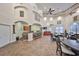 Large clubhouse features a kitchen area with bar seating and multiple dining tables at 2160 Chianti Pl # 11-0117, Palm Harbor, FL 34683