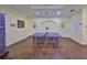 Bright game room featuring a ping pong table and hardwood floors for entertainment at 2160 Chianti Pl # 11-0117, Palm Harbor, FL 34683