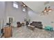 Bright living room with a soaring ceiling, multiple windows, ceiling fan, and comfortable furniture at 2160 Chianti Pl # 11-0117, Palm Harbor, FL 34683