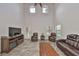 Bright living room with high ceilings, multiple windows, and comfortable leather furniture at 2160 Chianti Pl # 11-0117, Palm Harbor, FL 34683