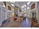Expansive lobby with stone fireplace, high ceilings, and inviting seating areas for residents at 2160 Chianti Pl # 11-0117, Palm Harbor, FL 34683
