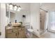 Bathroom featuring a stone countertop sink, shower, and tile flooring at 587 Lakewood Dr, Oldsmar, FL 34677