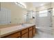 Clean and bright bathroom with white tiled tub and modern vanity with lots of space for storage at 587 Lakewood Dr, Oldsmar, FL 34677