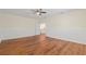Bright bedroom with hardwood floors, ceiling fan, and fresh paint providing a calming atmosphere at 587 Lakewood Dr, Oldsmar, FL 34677
