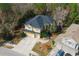 Lovely two-story home with a well-manicured lawn, a two-car garage, and a charming walkway to the entrance at 587 Lakewood Dr, Oldsmar, FL 34677
