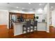 Open kitchen with stainless steel appliances, granite countertops, and breakfast bar with modern seating at 587 Lakewood Dr, Oldsmar, FL 34677