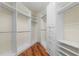 Spacious walk-in closet with custom shelving and drawers, offering ample storage and organization at 587 Lakewood Dr, Oldsmar, FL 34677