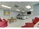 Comfortable clubhouse with kitchen area, bar seating, and cozy furniture at 7050 Sunset S Dr # 208, South Pasadena, FL 33707