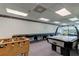 Spacious game room with foosball, air hockey and pool table with black cover at 7050 Sunset S Dr # 208, South Pasadena, FL 33707