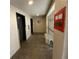 Hallway with elevator and a sun decoration on the wall at 7050 Sunset S Dr # 208, South Pasadena, FL 33707