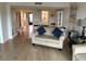 Relaxing living room blends seamlessly with the dining area, enhanced by bright natural light and stylish decor at 7050 Sunset S Dr # 208, South Pasadena, FL 33707