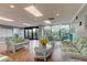 Well-lit lobby featuring wicker furniture, decorative details, and views of the outdoors at 7050 Sunset S Dr # 208, South Pasadena, FL 33707