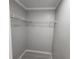 Walk-in closet with ample storage shelving at 9334 Ledgestone Ln, Port Richey, FL 34668