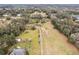 Vast rural acreage, featuring a long driveway leading to the home, surrounded by large trees at 3009 Jim Johnson Rd, Plant City, FL 33566